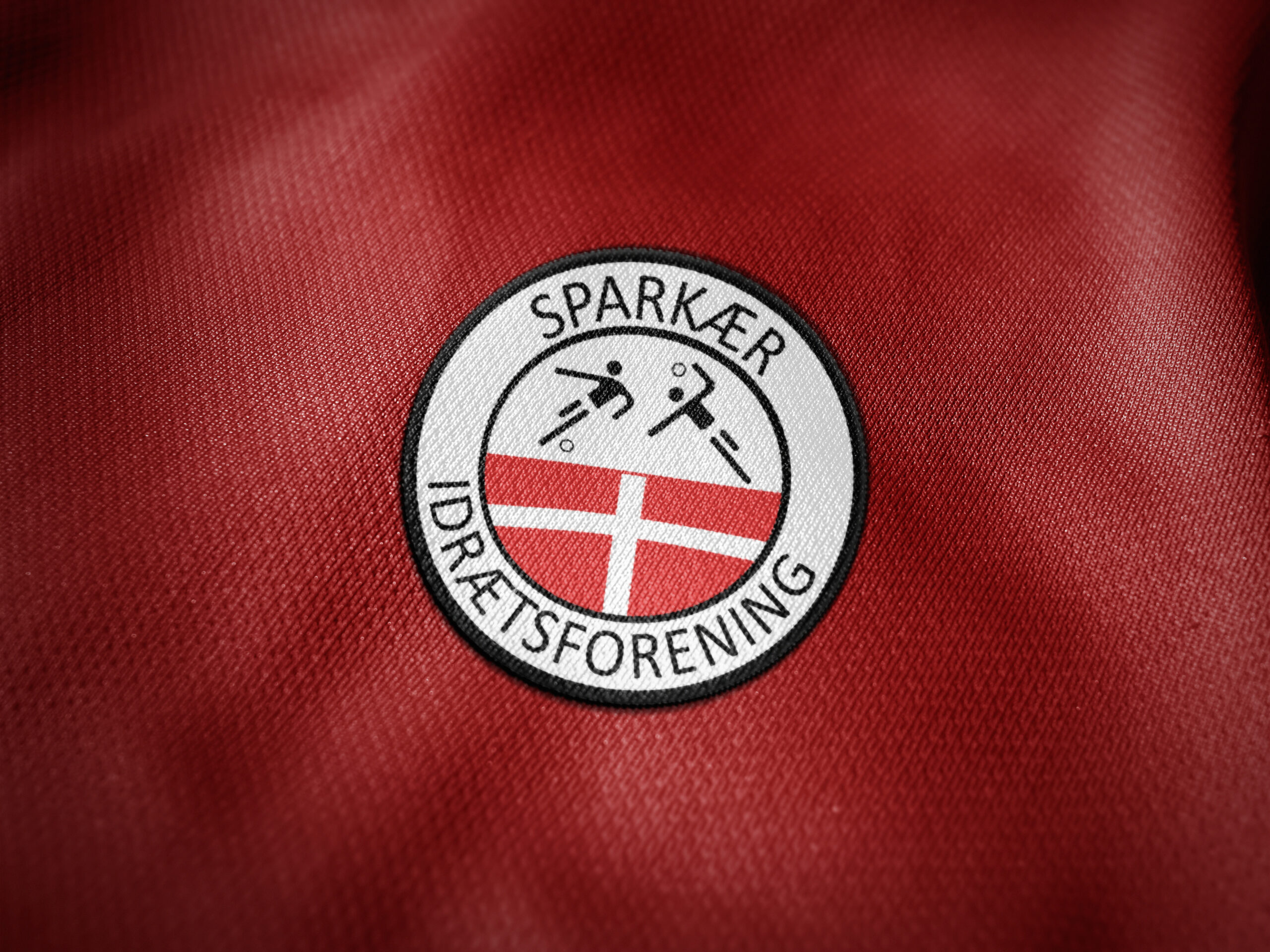 Sparkaer logo paa troeje scaled